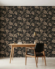 Noir Leaves dramatic black botanical as a feature wall in a bright home office