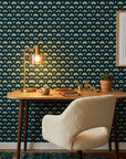 Ocean Fortress teal and navy geometric scale wallpaper adding character to a cozy bedroom