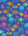 A patterned blue wall paper design featuring lively, silhouette-style depictions of marine animals