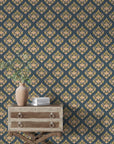 Navy and gold Old World Flora damask wallpaper styled with vintage dresser and botanical decor
