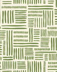 Olive green abstract wallpaper with hand drawn brush stroke blocks arranged in a loose geometric grid on a warm cream background.