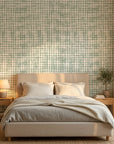 Pale Dawn serene green plaid wallpaper adding character to a cozy bedroom