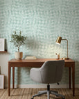 Pale Dawn serene green plaid wallpaper as a feature wall in a bright home office