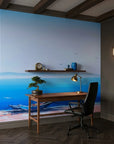 Pale Horizon serene blue coastal landscape wallpaper adding character to a cozy bedroom