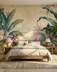 Tropical Parchment & Bloom wallpaper with oversized banana leaves and pink flowers on textured beige background in bedroom