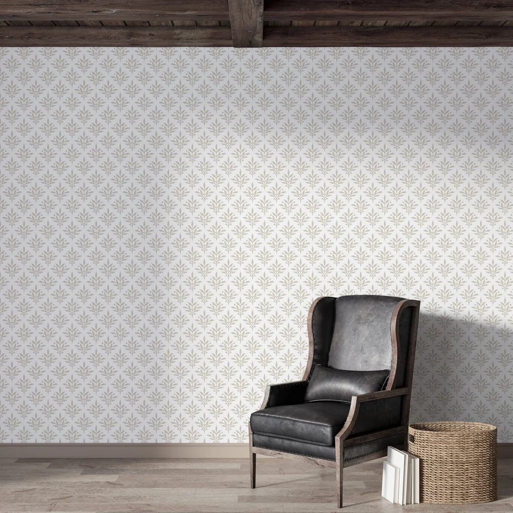 Taupe and cream Pastel Bouquet Parade botanical wallpaper in rustic living room with leather chair