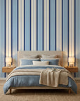 Pavilion Stripe blue and grey striped wallpaper adding character to a cozy bedroom
