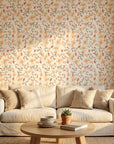 Peach Bloom coral floral peel and stick wallpaper as a feature wall in a bright home office
