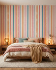 Peach & Flame retro stripe peel and stick wallpaper adding character to a cozy bedroom