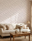 Pepper Blush delicate black ditsy floral wallpaper in a warm and inviting living room