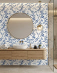 Periwinkle Blossom elegant blue floral wallpaper creating ambiance in a serene bathroom