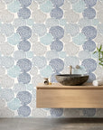 Petal Cascade blue swirls peel and stick wallpaper creating ambiance in a serene bathroom