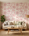 Petal Drift blush pink cherry blossom wallpaper in a warm and inviting living room