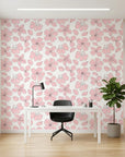 Petal Drift blush pink cherry blossom wallpaper as a feature wall in a bright home office