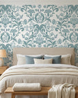 Petal Reflection soft blue floral damask wallpaper adding character to a cozy bedroom
