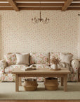 Petal Confetti cheerful ditsy floral wallpaper in a warm and inviting living room