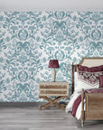 Teal and white Petal Reflection damask wallpaper on bedroom accent wall with vintage furnishings