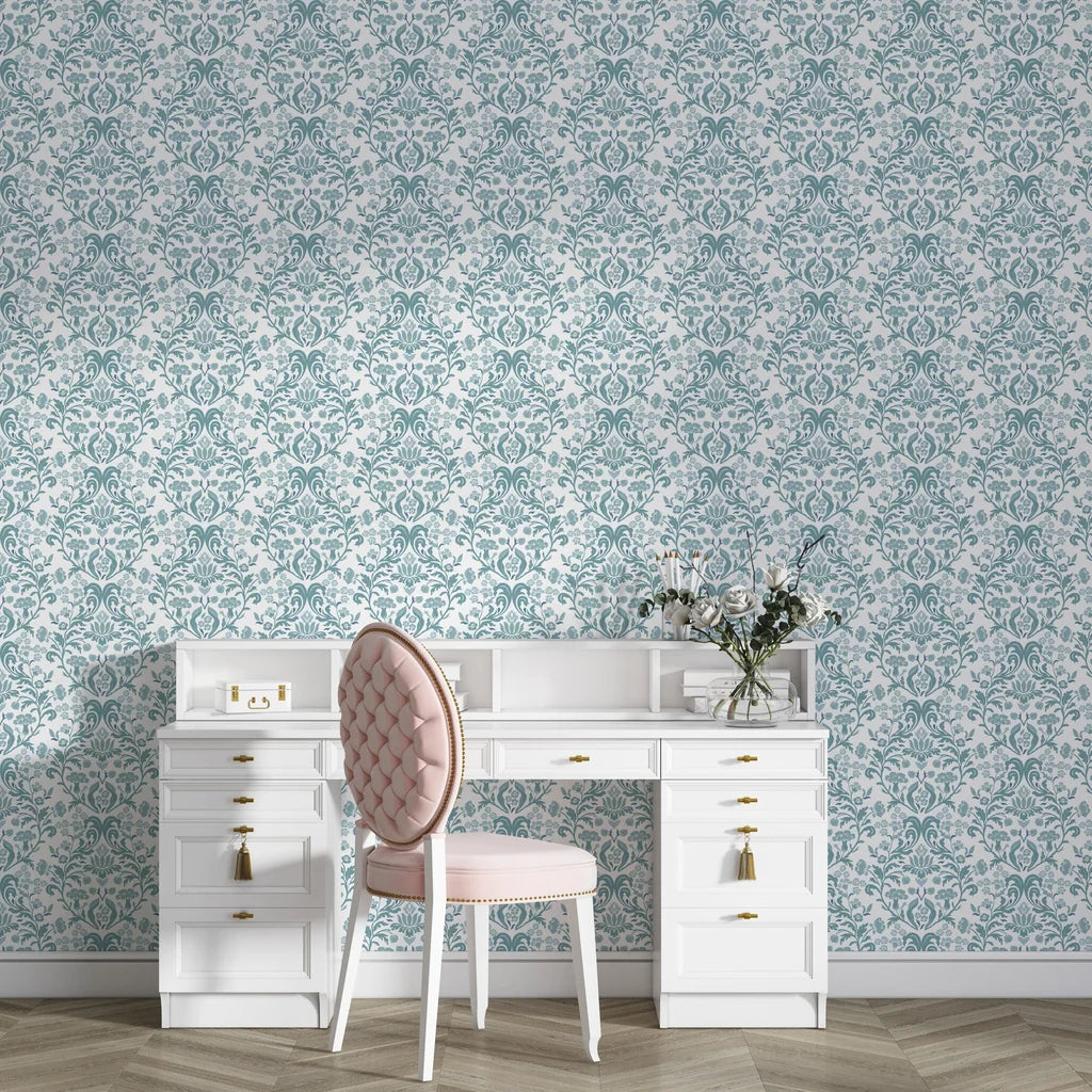 Petal Reflection damask wallpaper in teal and cream behind white vanity desk with pink chair