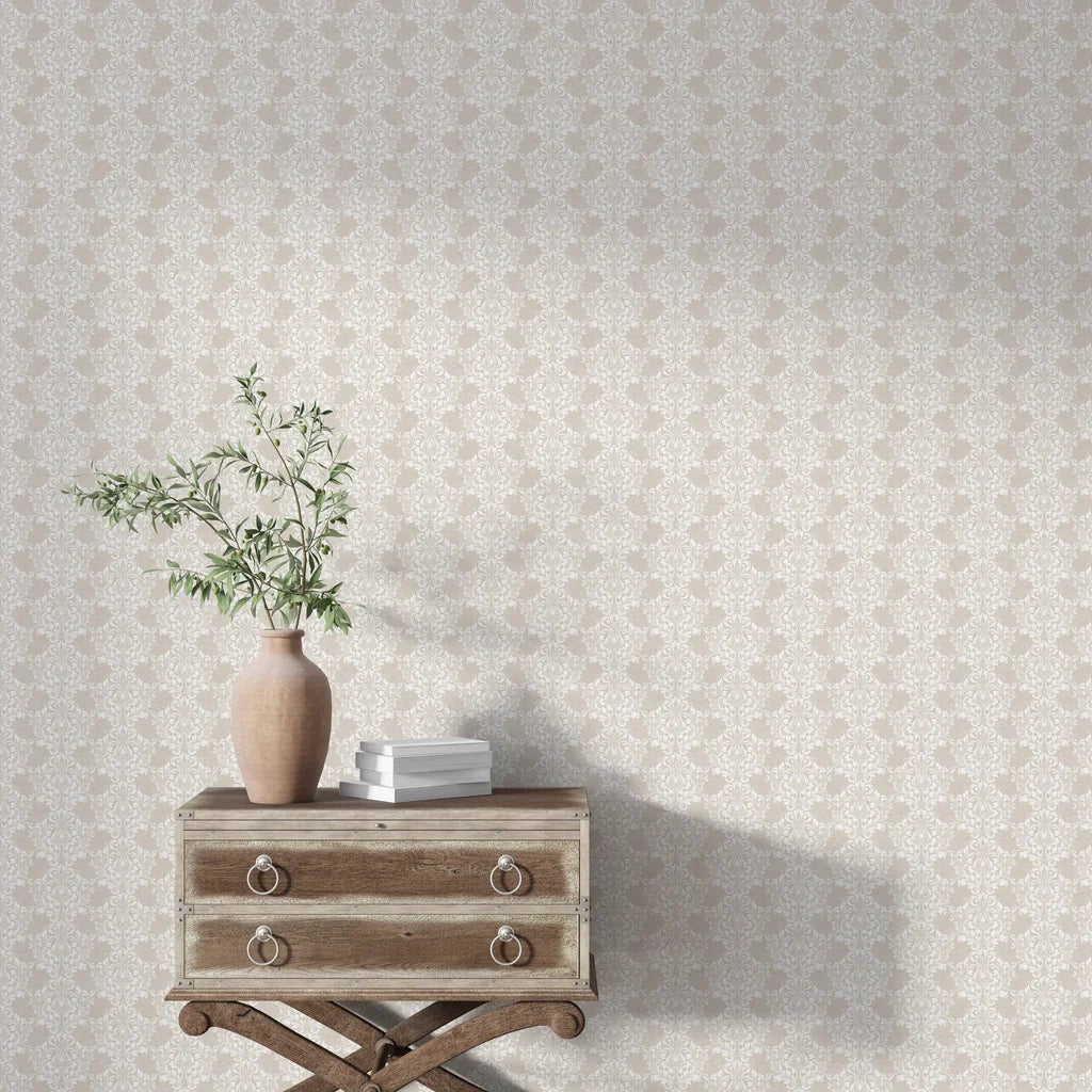 Beige and white Petal Symphony damask wallpaper in elegant room with vintage dresser and greenery