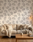 Pewter Leaf textured gray botanical wallpaper in a warm and inviting living room