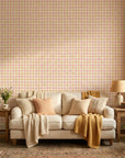 Picnic Check yellow and pink plaid wallpaper in a warm and inviting living room