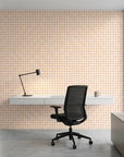 Picnic Check yellow and pink plaid wallpaper as a feature wall in a bright home office