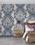Navy and cream Poet's Blossom damask wallpaper in elegant bedroom with vintage furnishings