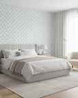 Poppy Ribbon playful blue striped floral wallpaper adding character to a cozy bedroom