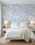 Porcelain Garden blue and white hummingbird floral wallpaper adding character to a cozy bedroom