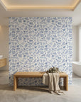 Porcelain Garden blue and white hummingbird floral wallpaper creating ambiance in a serene bathroom