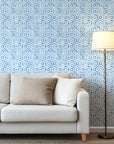 Blue porcelain style watercolor diamond wallpaper with hand painted geometric shapes forming a repeating lattice pattern on a white background.