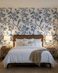 Porcelain Spring blue and white chinoiserie floral wallpaper adding character to a cozy bedroom