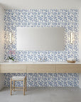 Porcelain Spring blue and white chinoiserie floral wallpaper creating ambiance in a serene bathroom