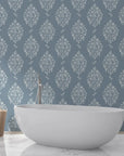 Porcelain Bouquet damask wallpaper in slate blue with silver motifs behind freestanding bathtub