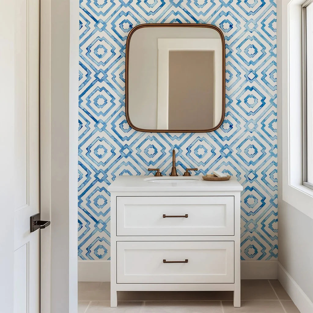 A repeating blue lattice pattern formed by hand-drawn geometric diamond motifs on a crisp white wall covering, rendered in a delicate watercolor and porcelain style