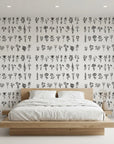 Pressed Botanicals black and white wildflower wallpaper adding character to a cozy bedroom