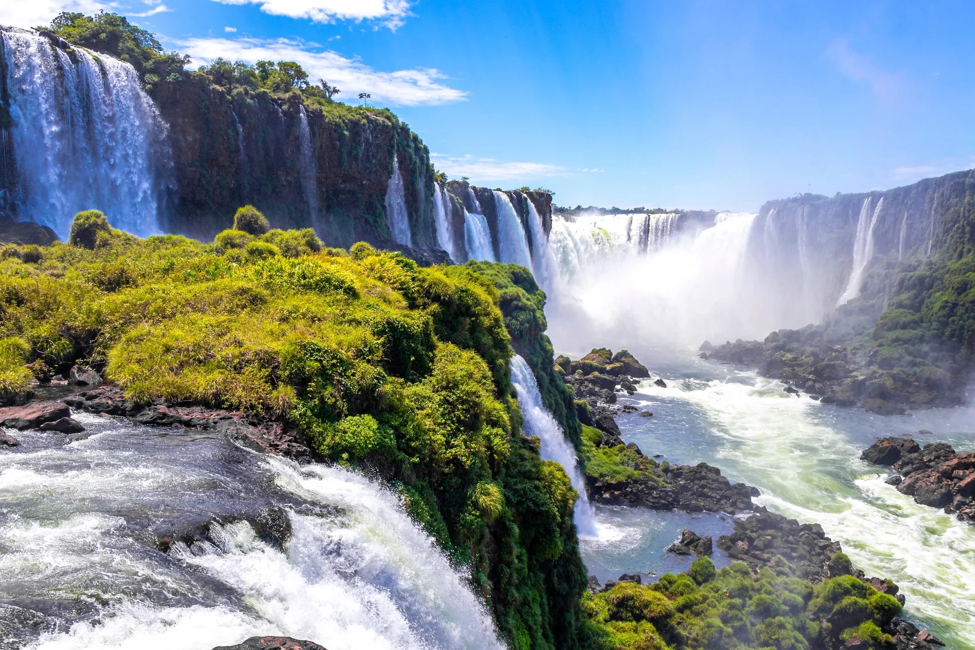 Energetic water spray from powerful falls removable wallpaper