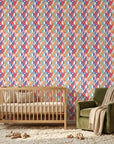 Prism Weave colorful geometric peel and stick wallpaper bringing warmth to a peaceful nursery