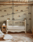 Children’s cat pattern wallpaper displayed on an interior wall with repeating kitten faces