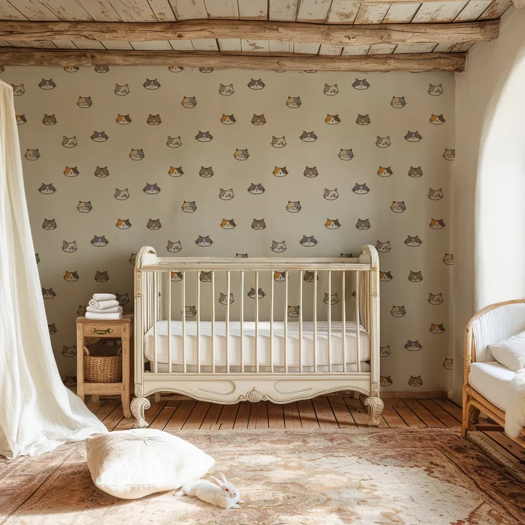Removable self-adhesive wall covering in a smooth cream tone with small feline head illustrations - Purr Mirage