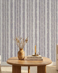 Quiet Dusk textured lavender striped wallpaper in a warm and inviting living room
