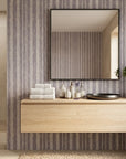 Quiet Dusk textured lavender striped wallpaper creating ambiance in a serene bathroom