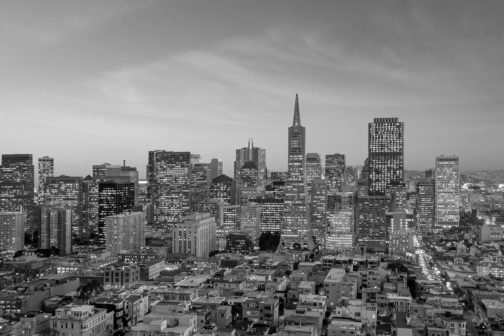 Monochrome San Francisco skyline Quiet Hours wallpaper with illuminated buildings at dusk