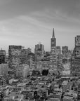 Monochrome San Francisco skyline Quiet Hours wallpaper with illuminated buildings at dusk
