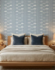 Quiet Room blue geometric peel and stick wallpaper adding character to a cozy bedroom