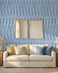 Rain Season coastal blue striped wallpaper in a warm and inviting living room