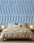 Rain Season coastal blue striped wallpaper adding character to a cozy bedroom