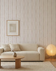 Rain Veil soft taupe vertical stripe wallpaper in a warm and inviting living room