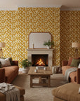 Rolling Fathoms golden painterly leaf wallpaper in a warm and inviting living room