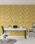 Rolling Fathoms golden painterly leaf wallpaper as a feature wall in a bright home office